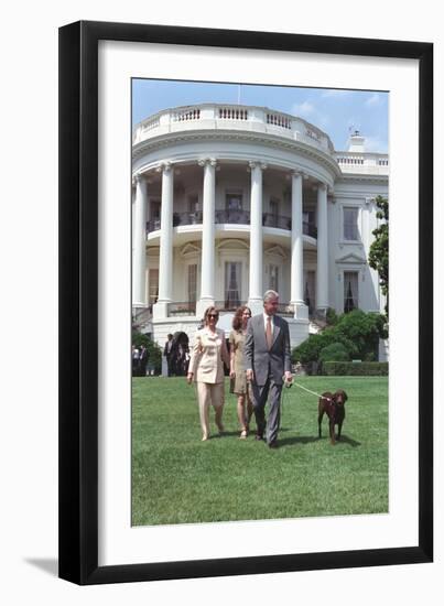 President Bill Clinton, Hillary and Chelsea Clinton, and Buddy the Dog on the South Lawn-null-Framed Photo