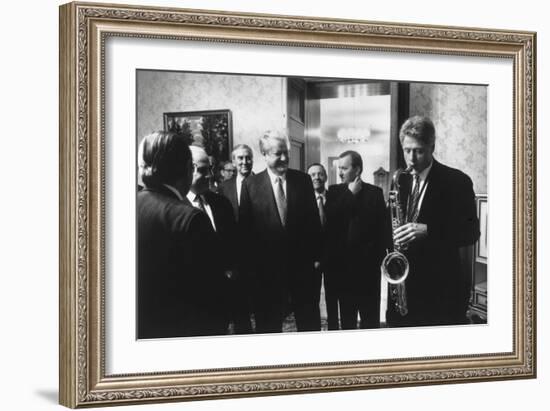 President Bill Clinton Plays the Saxophone Presented to Him by Russian President Boris Yeltsin-null-Framed Premium Photographic Print