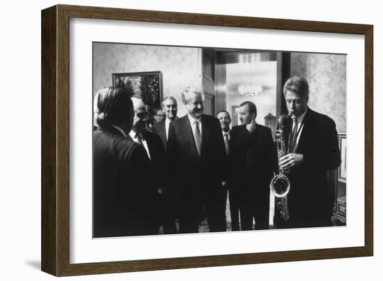 President Bill Clinton Plays the Saxophone Presented to Him by Russian President Boris Yeltsin-null-Framed Premium Photographic Print