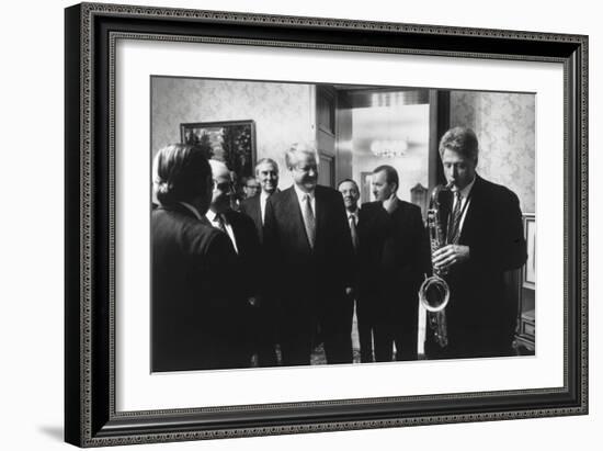 President Bill Clinton Plays the Saxophone Presented to Him by Russian President Boris Yeltsin-null-Framed Premium Photographic Print