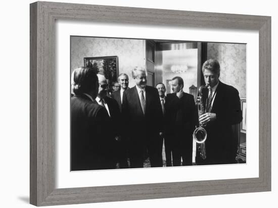 President Bill Clinton Plays the Saxophone Presented to Him by Russian President Boris Yeltsin-null-Framed Photo