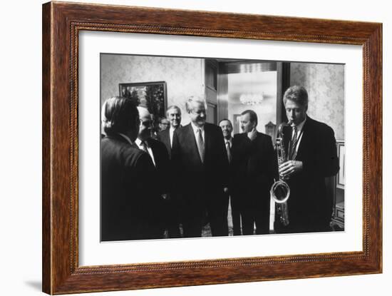 President Bill Clinton Plays the Saxophone Presented to Him by Russian President Boris Yeltsin-null-Framed Photo