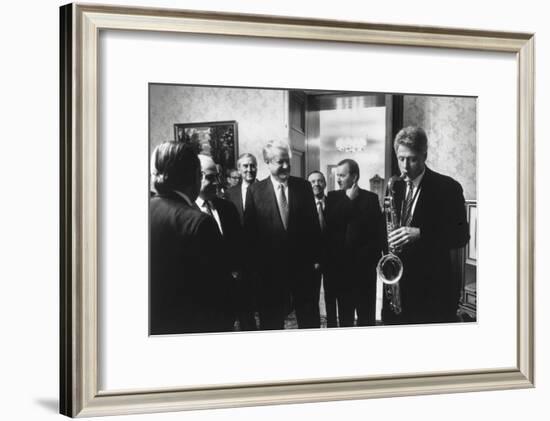 President Bill Clinton Plays the Saxophone Presented to Him by Russian President Boris Yeltsin-null-Framed Photo
