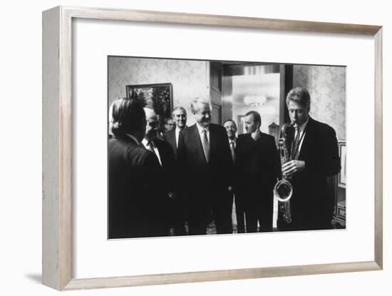 President Bill Clinton Plays the Saxophone Presented to Him by Russian President Boris Yeltsin-null-Framed Photo