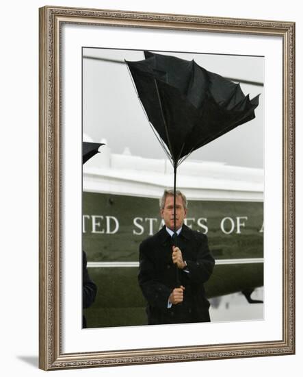 President Bush Jokingly Holds His Wind-Blown Umbrella Upright-null-Framed Photographic Print