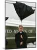 President Bush Jokingly Holds His Wind-Blown Umbrella Upright-null-Mounted Photographic Print