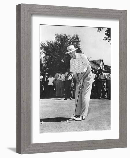 President Dwight Eisenhower on a Golf Course Putting Green-null-Framed Photo