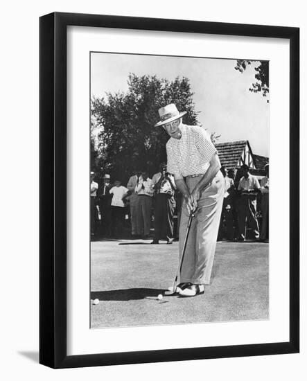 President Dwight Eisenhower on a Golf Course Putting Green-null-Framed Photo