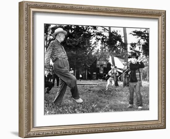 President Eisenhower Adds a Little 'Body English' to David Eisenhower's Golf Swing-null-Framed Photo