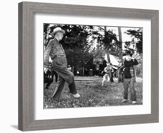 President Eisenhower Adds a Little 'Body English' to David Eisenhower's Golf Swing-null-Framed Photo