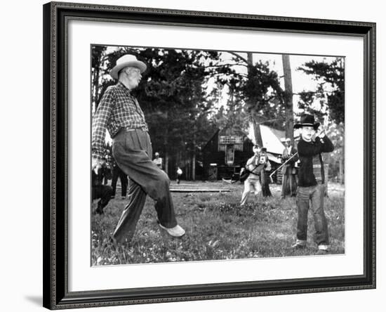 President Eisenhower Adds a Little 'Body English' to David Eisenhower's Golf Swing-null-Framed Photo