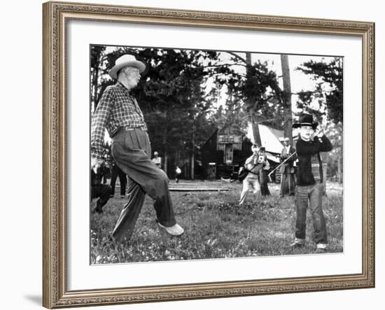 President Eisenhower Adds a Little 'Body English' to David Eisenhower's Golf Swing-null-Framed Photo