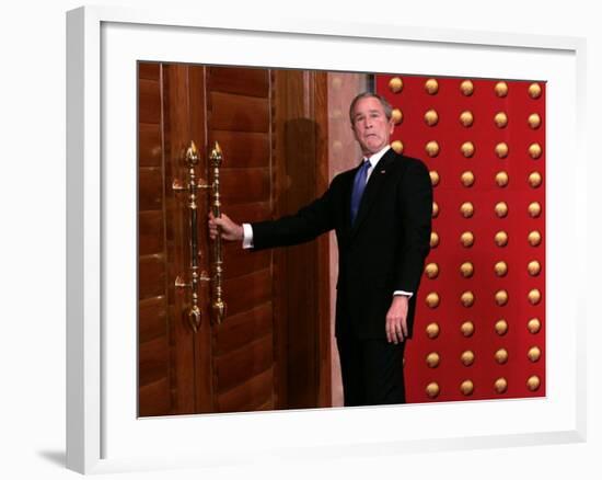 President George W. Bush as He Tries to Open a Locked Door Leaving a Press Conference in Beijing-null-Framed Photographic Print