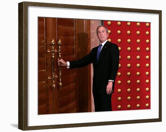 President George W. Bush as He Tries to Open a Locked Door Leaving a Press Conference in Beijing-null-Framed Photographic Print