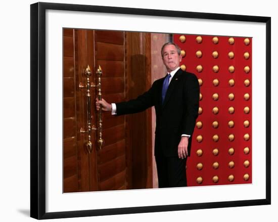 President George W. Bush as He Tries to Open a Locked Door Leaving a Press Conference in Beijing-null-Framed Photographic Print