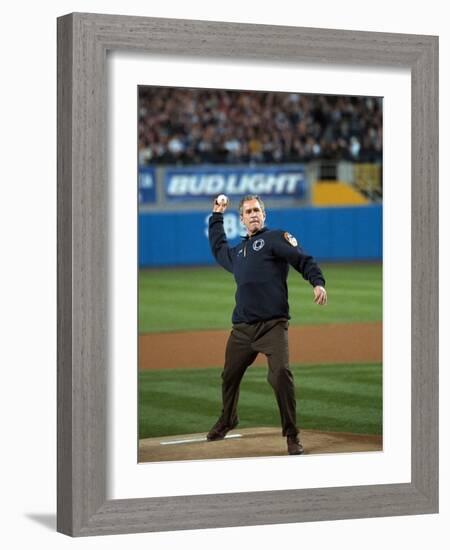 President George W. Bush Throws the Ceremonial First Pitch at Yankee Stadium-null-Framed Photo