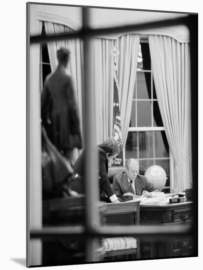 President Gerald Ford Working at His Desk, Washington, D.C., 1975-Marion S^ Trikosko-Mounted Photo
