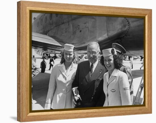 President Harry S. Truman Standing Near a Plane Flanked by Stewardesses-null-Framed Premier Image Canvas