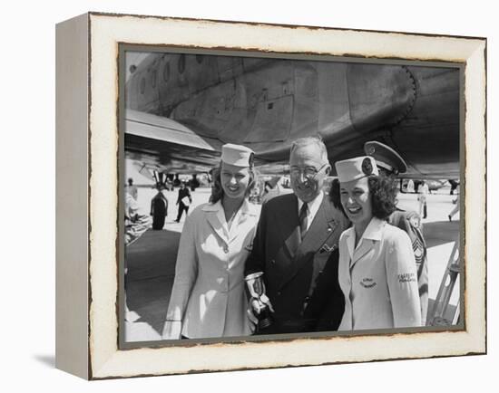 President Harry S. Truman Standing Near a Plane Flanked by Stewardesses-null-Framed Premier Image Canvas