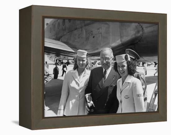 President Harry S. Truman Standing Near a Plane Flanked by Stewardesses-null-Framed Premier Image Canvas