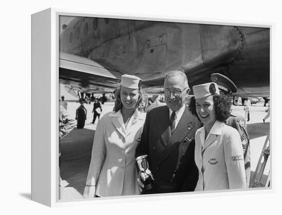 President Harry S. Truman Standing Near a Plane Flanked by Stewardesses-null-Framed Premier Image Canvas