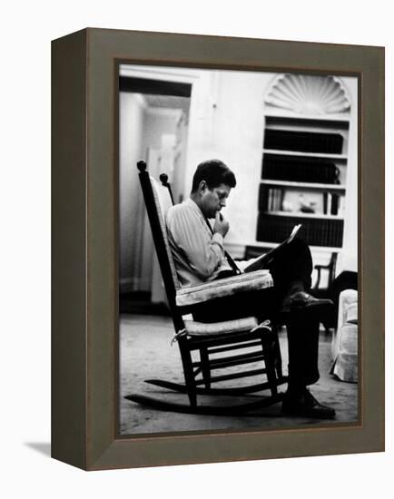 President John F. Kennedy Sitting Alone, Thoughtfully, in His Rocking Chair in the Oval Office-Paul Schutzer-Framed Premier Image Canvas