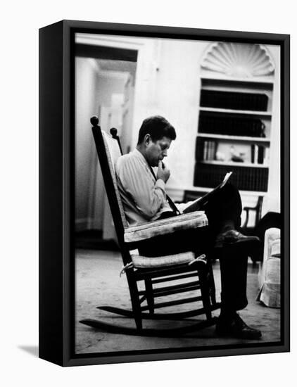 President John F. Kennedy Sitting Alone, Thoughtfully, in His Rocking Chair in the Oval Office-Paul Schutzer-Framed Premier Image Canvas