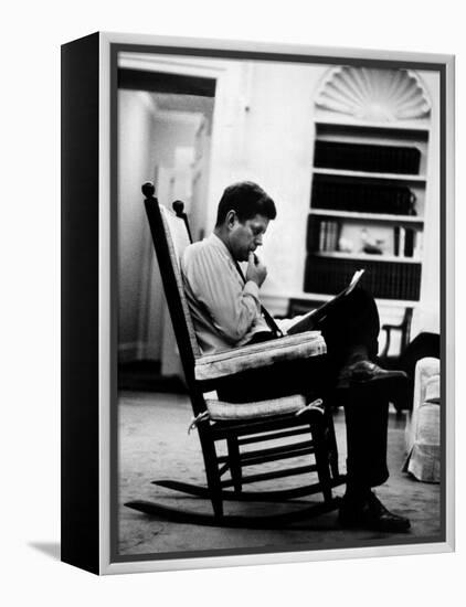 President John F. Kennedy Sitting Alone, Thoughtfully, in His Rocking Chair in the Oval Office-Paul Schutzer-Framed Premier Image Canvas