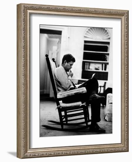 President John F. Kennedy Sitting Alone, Thoughtfully, in His Rocking Chair in the Oval Office-Paul Schutzer-Framed Photographic Print