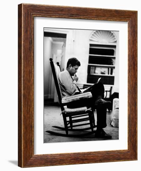 President John F. Kennedy Sitting Alone, Thoughtfully, in His Rocking Chair in the Oval Office-Paul Schutzer-Framed Photographic Print