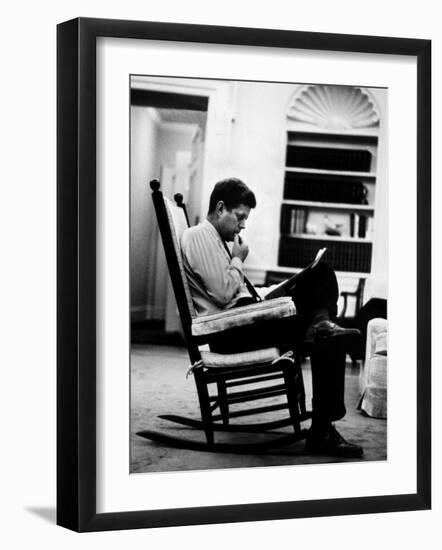 President John F. Kennedy Sitting Alone, Thoughtfully, in His Rocking Chair in the Oval Office-Paul Schutzer-Framed Photographic Print