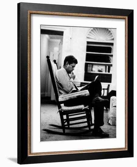 President John F. Kennedy Sitting Alone, Thoughtfully, in His Rocking Chair in the Oval Office-Paul Schutzer-Framed Photographic Print