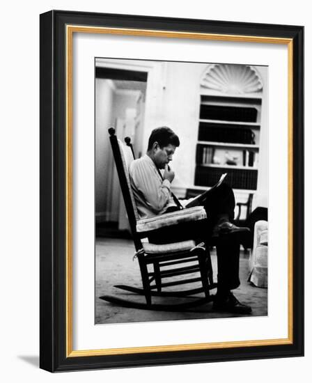 President John F. Kennedy Sitting Alone, Thoughtfully, in His Rocking Chair in the Oval Office-Paul Schutzer-Framed Photographic Print