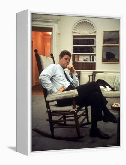President John F. Kennedy Sitting in Rocking Chair in His White House Office-Paul Schutzer-Framed Premier Image Canvas