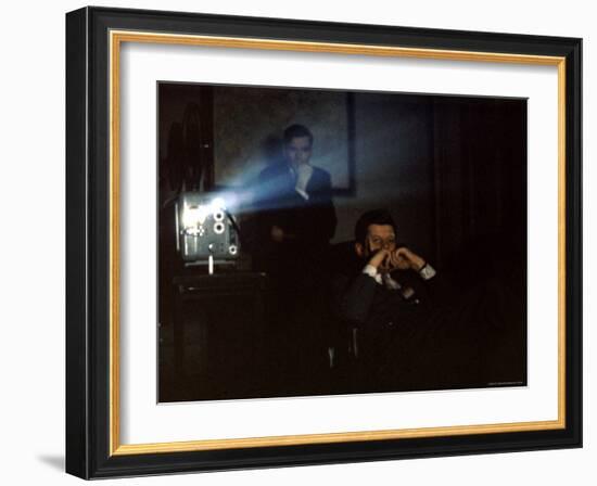 President John F. Kennedy Viewing a Film in Press Secretary Pierre Salinger's Office-Paul Schutzer-Framed Photographic Print