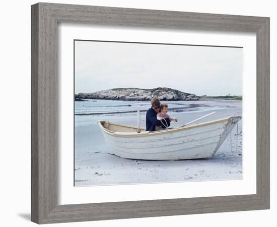 President John Kennedy and John Jr. Play in a Beached Rowboat at Newport, Rhode Island. 1962-null-Framed Photo