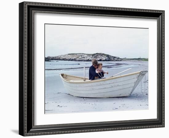 President John Kennedy and John Jr. Play in a Beached Rowboat at Newport, Rhode Island. 1962-null-Framed Photo