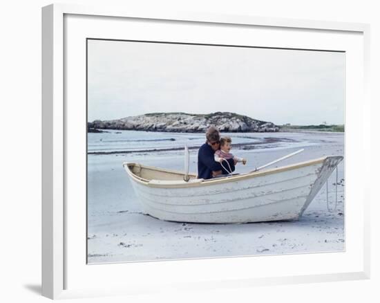 President John Kennedy and John Jr. Play in a Beached Rowboat at Newport, Rhode Island. 1962-null-Framed Photo