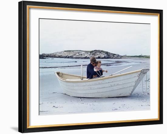 President John Kennedy and John Jr. Play in a Beached Rowboat at Newport, Rhode Island. 1962-null-Framed Photo