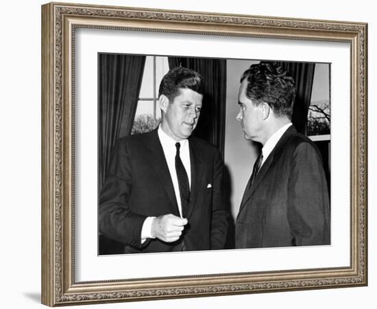 President John Kennedy Confers with Former Vice President Richard Nixon-null-Framed Photo