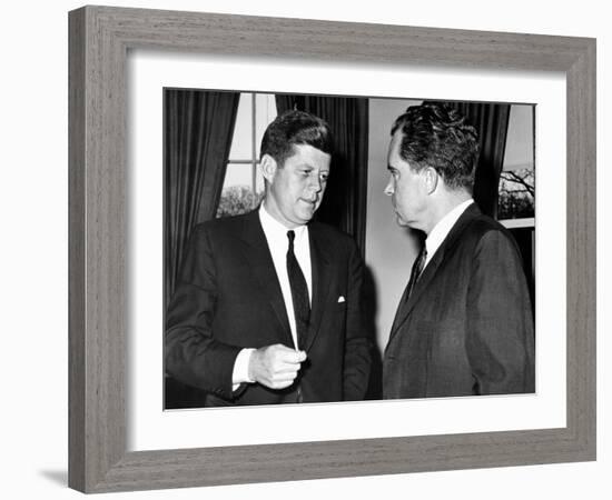 President John Kennedy Confers with Former Vice President Richard Nixon-null-Framed Photo