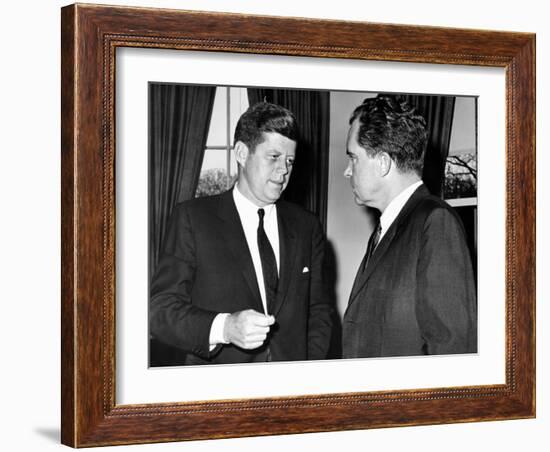 President John Kennedy Confers with Former Vice President Richard Nixon-null-Framed Photo