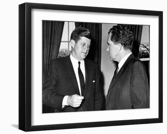 President John Kennedy Confers with Former Vice President Richard Nixon-null-Framed Photo