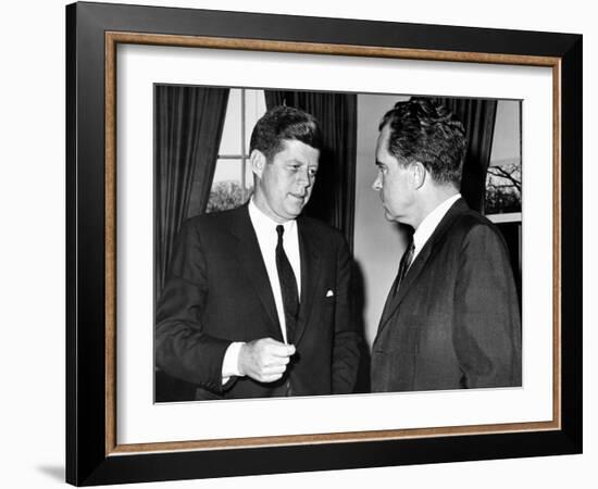 President John Kennedy Confers with Former Vice President Richard Nixon-null-Framed Photo