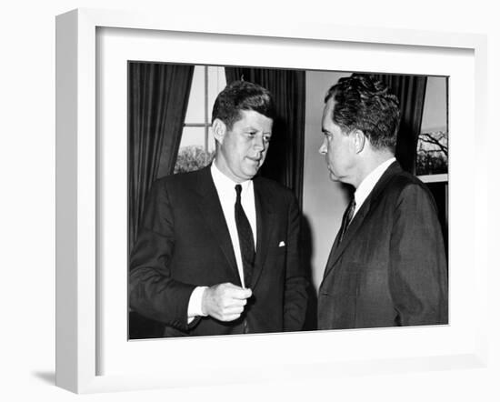 President John Kennedy Confers with Former Vice President Richard Nixon-null-Framed Photo