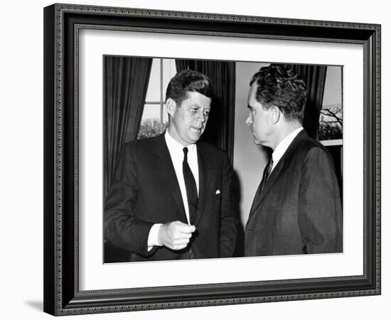 President John Kennedy Confers with Former Vice President Richard Nixon-null-Framed Photo