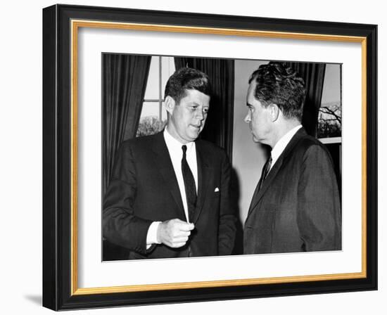 President John Kennedy Confers with Former Vice President Richard Nixon-null-Framed Photo