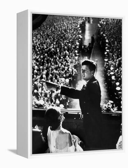 President John Kennedy Next to His Wife Jacqueline Overlooking Crowd Attending His Inaugural Ball-Paul Schutzer-Framed Premier Image Canvas