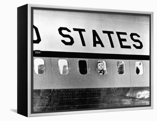 President John Kennedy Peers Out from Window of Air Force One-null-Framed Stretched Canvas