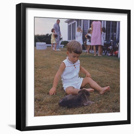 President Kennedy's Two Year Old Son, John Jr. Playing with a Puppy, Aug. 3, 1963-null-Framed Photo